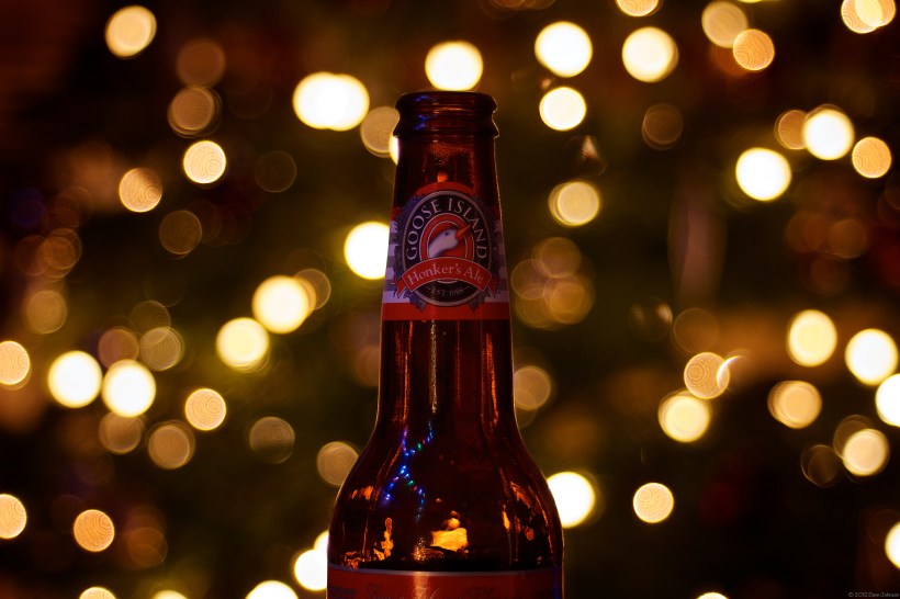 Bottle in front of Christmas Tree