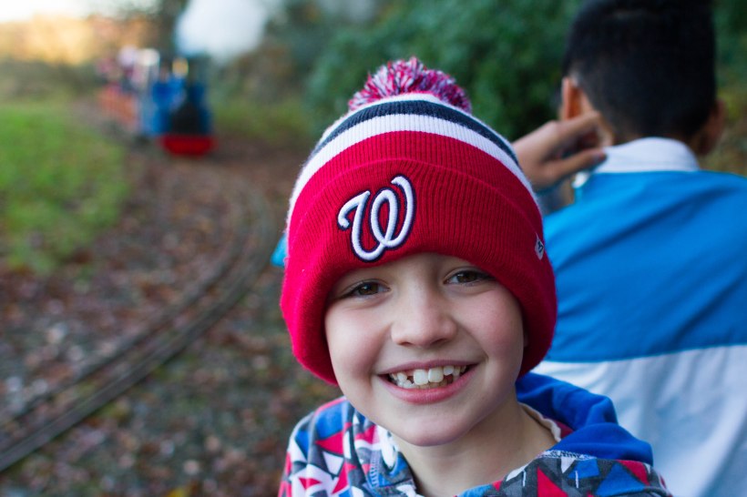 Ben riding the miniature railway
